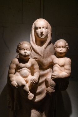 a statue of a person holding a baby